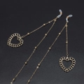 Golden heart metal eyewear chains with beaded accents and silicone loops on black background - Gold Hollow Heart Style