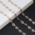 Elegant gold hollow leaf chain glasses strap displayed on a minimalist contrast background - Hollow Leaf Style / Gold