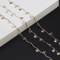 Minimalist gold star chain eyewear strap and long necklace on black and white background - Gold Star Style