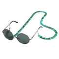 Close-up of green tortoise shell acrylic eyeglass chain with round metal sunglasses - Turquoise Amber Pattern