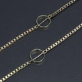 Golden box chain eyewear strap featuring minimalist hollow circular geometric pendants - Gold