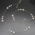Elegant gold metal eyeglass chain with alternating white pearls on a black background - Pearl Inlaid Style (GL419) / Gold