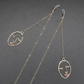 Golden anti-slip eyewear chain featuring red lip abstract face pendants and silicone loops - Gold Abstract Face