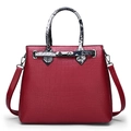 Red crocodile embossed leather handbag for women with snakeskin pattern handles and silver lock - Red