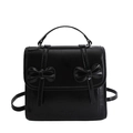 Mochila negra brillante estilo preppy con lazos dobles decorativos y acabado pulido - Negro