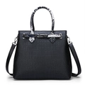 Glossy black crocodile pattern handbag with snake print handle and silver twist lock - Black
