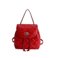 Elegant red quilted backpack featuring a glossy finish and silver chain strap detail - Red