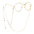 Golden peace symbol metal chain for glasses with a minimalist design on white background - Gold