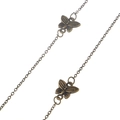 Vintage bronze sunglasses chain with textured butterfly pendants on a white background - Butterfly Pendant / Bronze