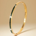 Gold plated stainless steel bangle featuring emerald green square zircon stones - Gold Color Black Stone Style (44-E-4)