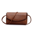 Minimalist caramel brown crossbody bag in pebble faux leather with flap closure - Brown