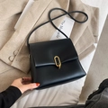 Classic black leather crossbody square bag with elegant gold oval metal buckle detail - Black