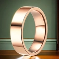 Polished rose gold 10mm wide stainless steel band ring on an elegant wooden surface - Size 6 / Rose Gold Polished (6mm)