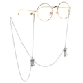 Silver owl charm eyewear chain with gold round glasses shown on a white background - Owl Silver Style