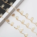 Gouden golvende brillenketting met uitgesneden smiley-hangers en gepolijste afwerking - Goud