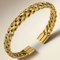 Close-up of golden braided stainless steel open bangle with smooth end caps and luxury texture - Gold Color (39乙-E-10)