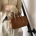 Dark brown matte suede Boston bag featuring contrast white stitching and top handles - Brown