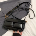 Black wrinkled leather underarm bag with gold studs and a classic double pocket design - Black