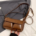 Vintage brown shoulder bag with dual pockets and textured leather in a minimalist style - Brown