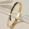 Golden bow-inspired stainless steel bracelet with black and white crystals - Gold-Tone Bow Design with Black Rhinestones