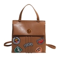 Retro brown PU leather backpack with vintage embroidery patches and turn-lock closure - Khaki