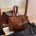 Retro brown leather tote bag with gold rivets and braided charm for winter commuting - Brown