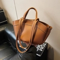 Brown litchi leather tote bag with dual handles and shoulder strap in bat-shaped design - Brown