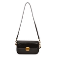Classic black oil-wax leather shoulder bag with vintage gold buckle on white background - Brown