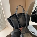 Minimalist black pebble leather tote bag with contrast white stitching and shoulder straps - Black