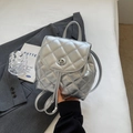 Silver metallic quilted mini backpack with circular twist lock and chain strap - Silver