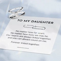 Detail of interlocking silver knot ring with sparkling stones and sentimental gift card - Silver Ring with Message Card