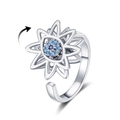 Rotating devil's eye ring with silver petals and blue zircon stones on white background - Adjustable Open / Silver