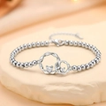 Ineengestrengelde ringen met hart-zirkonia op een zilverkleurige kralenarmband - Platina Hart In elkaar grijpende Kralen Stijl (XL0048)