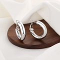 Orecchini a cerchio cavi minimalisti in finitura argento lucido per un look moderno - Oro Bianco