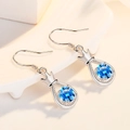 Elegant S925 silver crown earrings with a deep blue round-cut gemstone on wavy display - Silver-Blue Zirconia