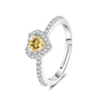 Macro shot of silver open ring with yellow heart gemstone and pavé cubic zirconia - Adjustable Open / Yellow Zirconia