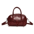 Retro burgundy bowling bag in glossy faux leather featuring decorative front bows - Red