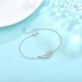 Elegant silver angel wing bracelet with sparkling pink crystals on a water wave background - Platinum Color-Pink Stone