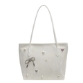 Chic cream tote bag featuring pearl embellishments and silver bow detail for women - Off-white