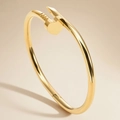 Polished 18K gold plated stainless steel nail bracelet with heart detail for women - Gold Heart Nail Style