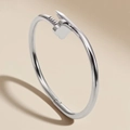 Titanium steel nail bracelet with clover detail in a polished silver finish - Steel Four-Flower Nail Style