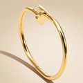 Polished 18K gold-plated titanium steel bangle with nail and clover design motifs - Gold Four-Flower Nail Style