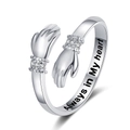 Macro view of hugging hands ring with sparkling zircon and Always in My Heart engraving - Always In My Heart