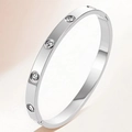 Polished silver titanium steel bangle with four round cubic zirconia settings - KJ Silver Four Diamonds Groove Style