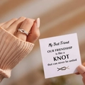 Silver knot ring with pave cubic zirconia stones displayed on a message card - Adjustable Open / Ring With Card