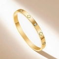Elegant rose gold titanium bangle featuring sparkling cubic zirconia and clover patterns - Gold Clover Outline Zirconia (35-D-8)