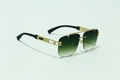 Detail of luxury rimless sunglasses with gold metal frame and carved wood grain legs - Gold Frame Gradient Green Lens