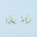 Detailed view of double layered gold spiral twist earrings with polished finish - Gold