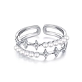 Detail showing double-layered silver ring with white pearls and zircon star charms - Star Style