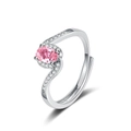 Macro detail of wave-shaped ring featuring pink oval stone and micro-pave crystals - Adjustable Open / Oval Cut Ring